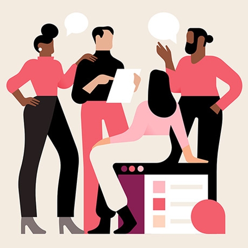 A diverse group of employees talk through a project together