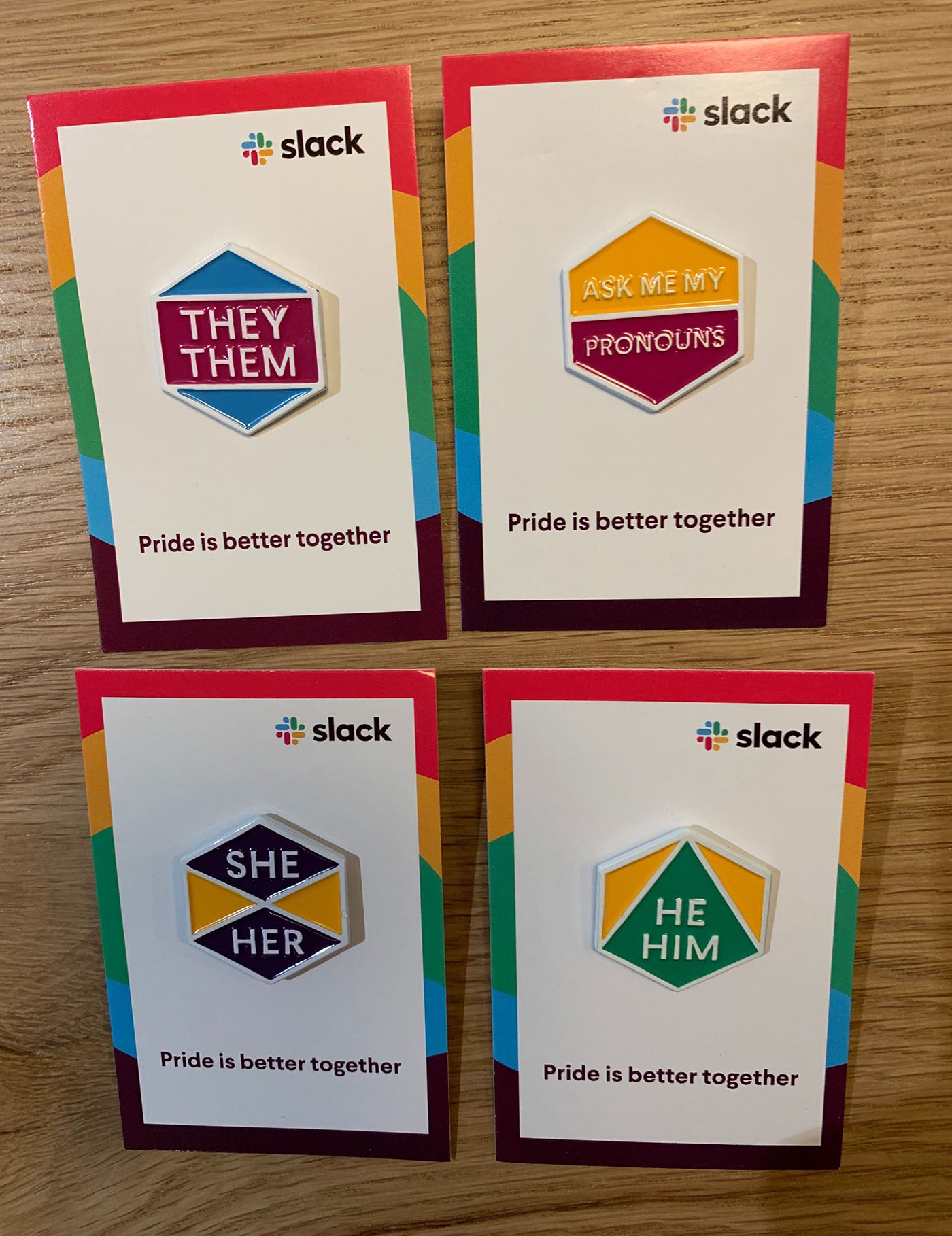Enamel pins to designate the wearer's correct pronoun and support the feature