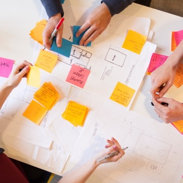 Team working together with notes and post-its