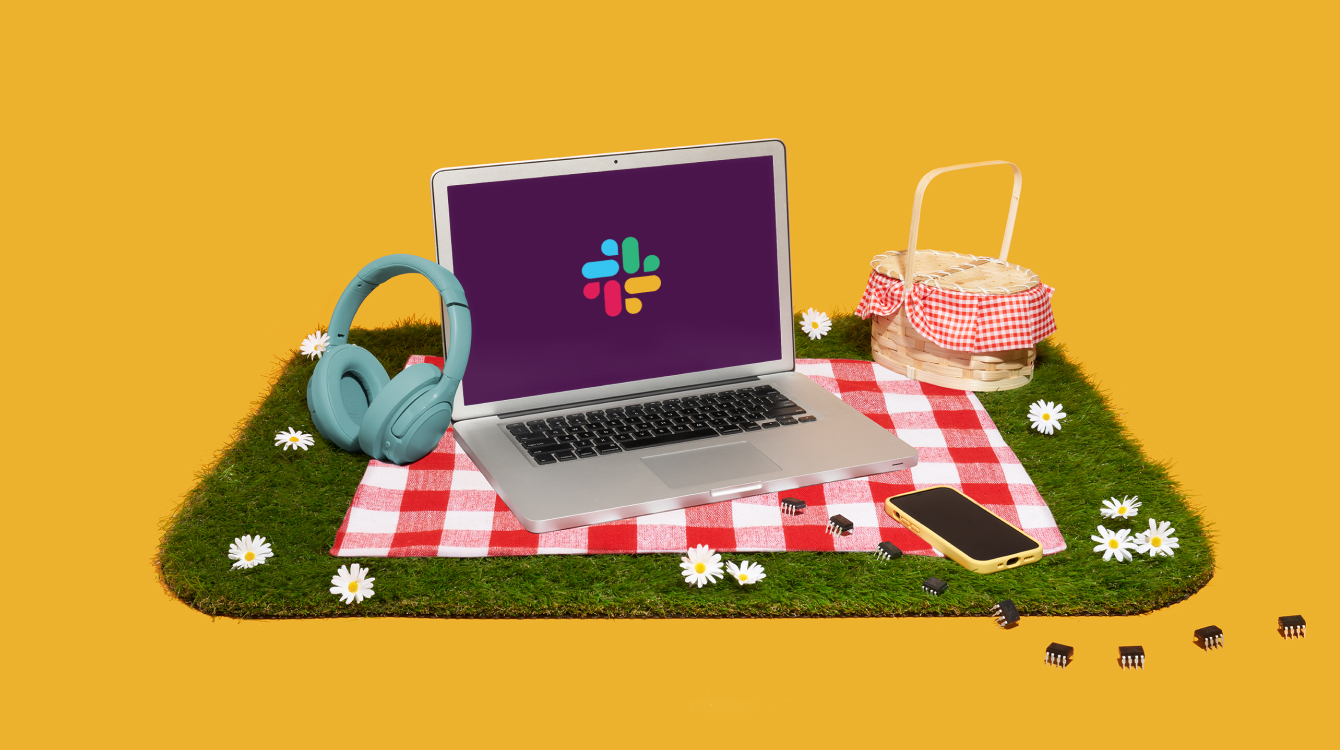 A picnic with a computer showing the Slack logo representing using Slack