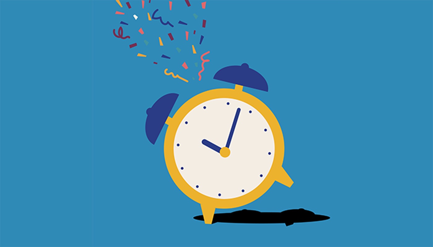 Celebration confetti above an alarm clock