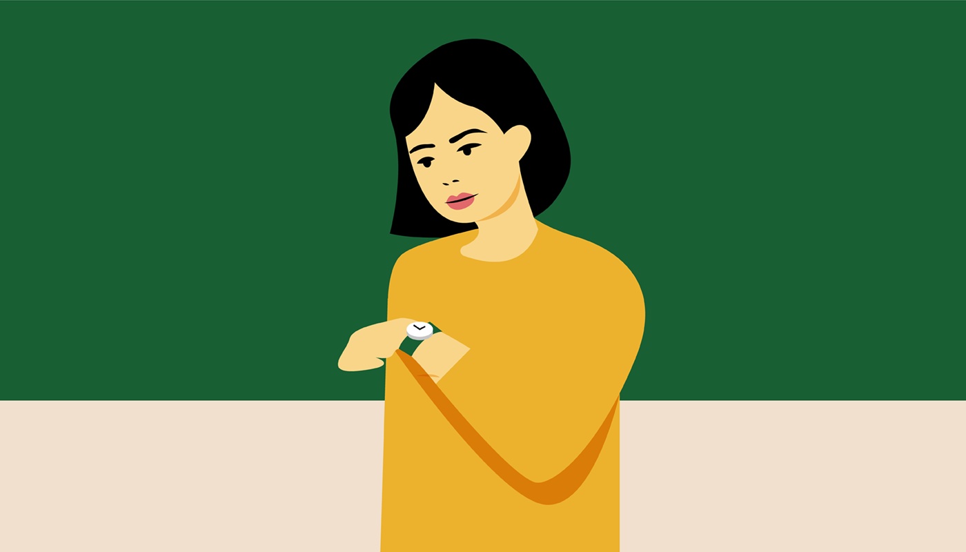 Woman checking the time on her watch