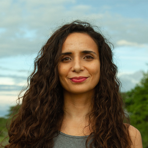 Headshot photo of Ella Al-Shamahi