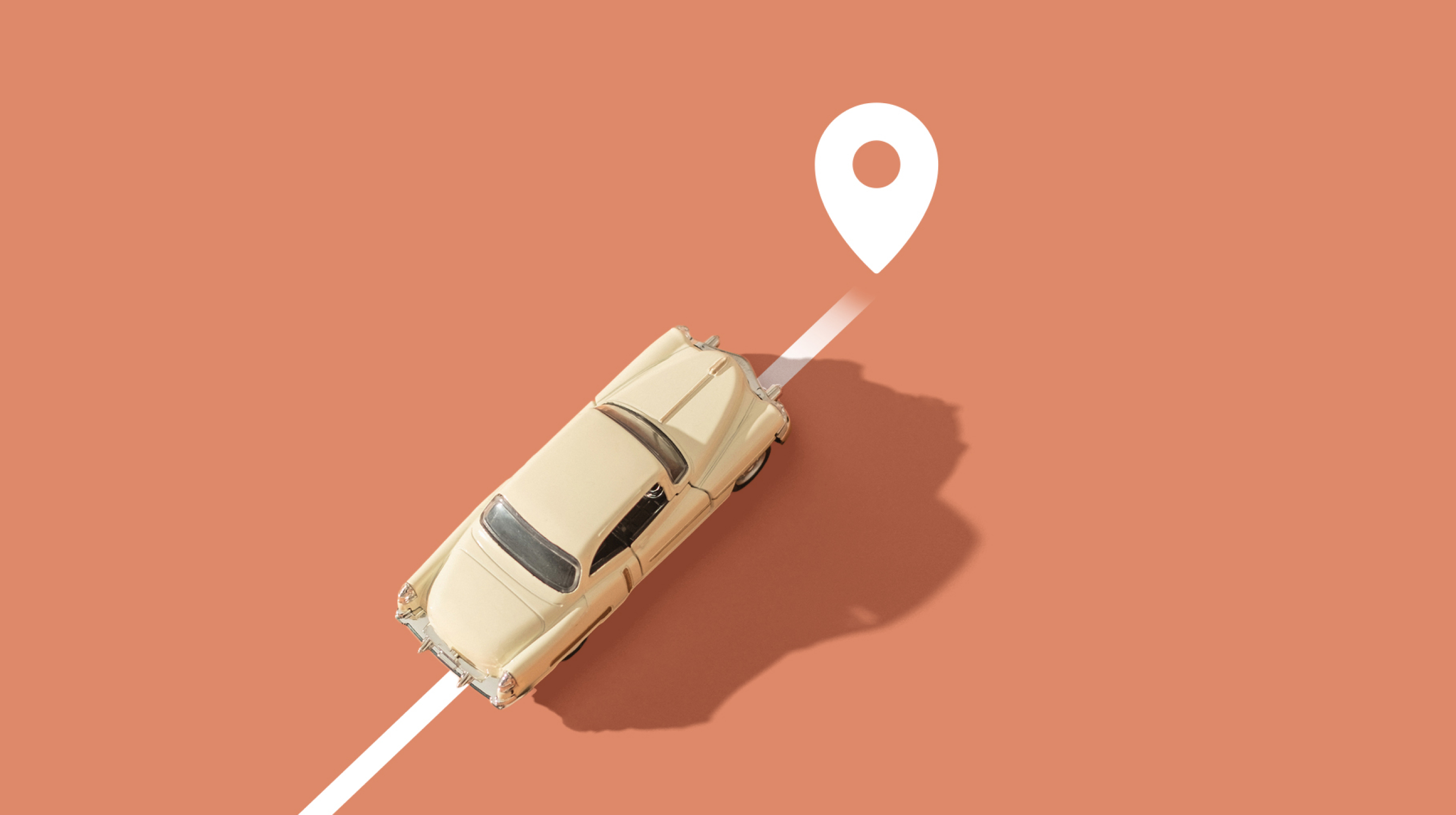 Car driving diagonally towards location mark