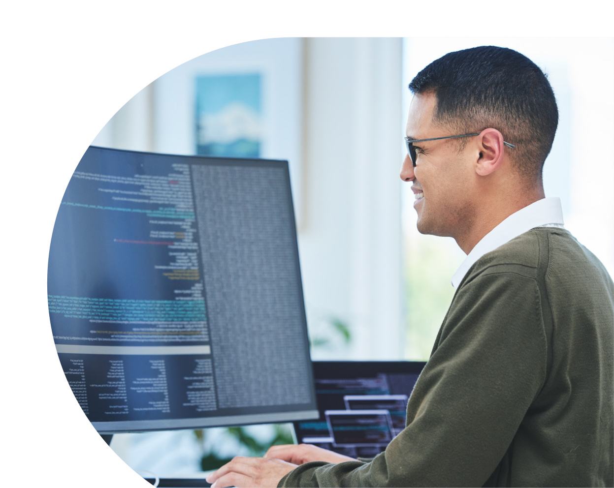 Security professional monitoring systems at desk