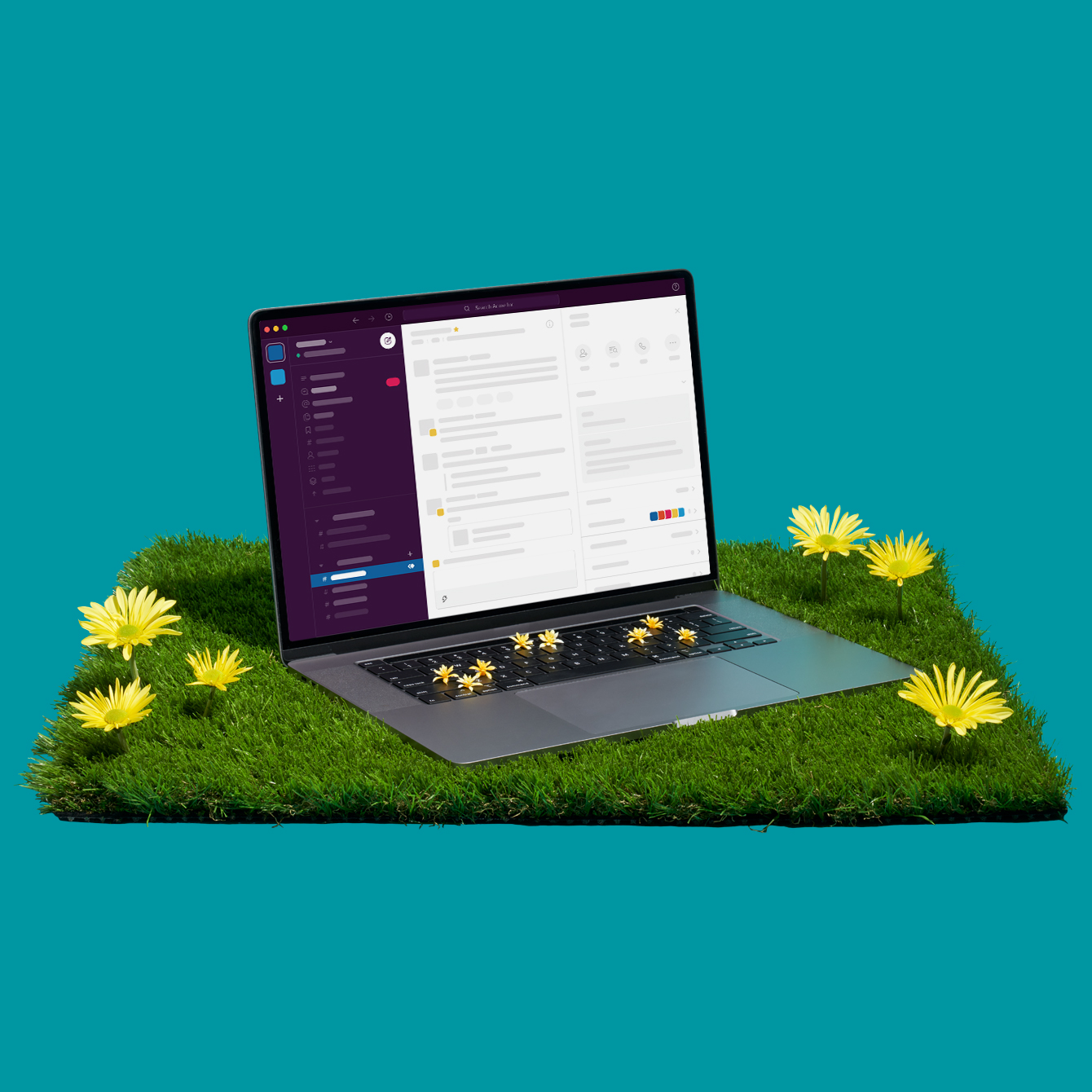 A laptop and blooming flowers sitting on turf