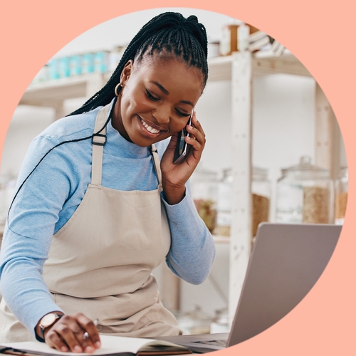 CRM for small business, symbolized by business owner working on her computer