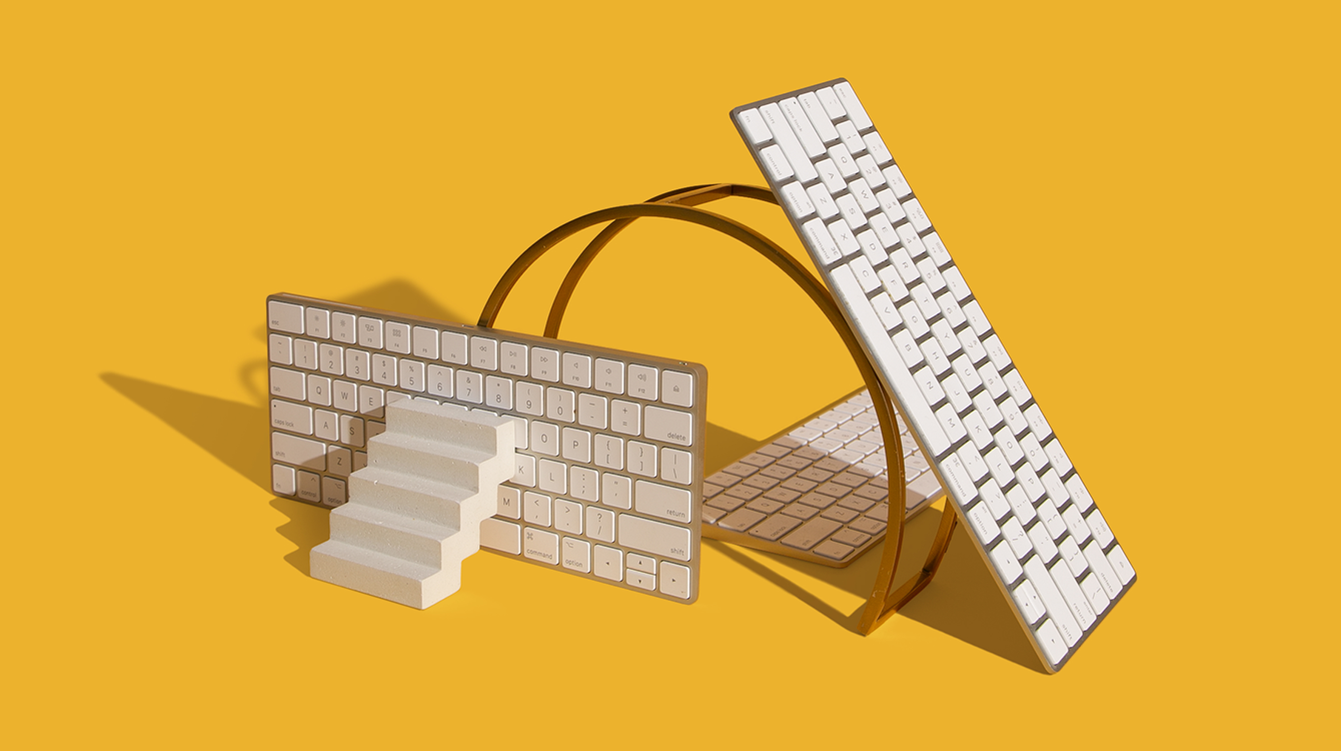 three keyboards and a staircase